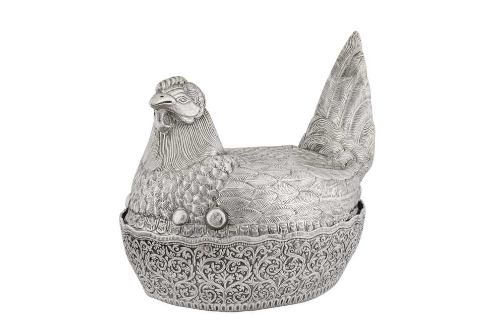 A rare early 20th century Burmese silver novelty 'hen on nest' egg cruet, Shan States dated 1904