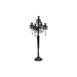 A CONTEMPORARY BLACK LACQUERED METAL FLOOR STANDING CANDELABRUM