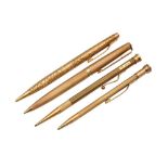 A GROUP OF FOUR GOLD PROPELLING PENCILS