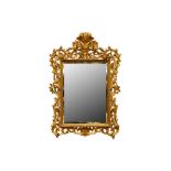 A CARVED, PIERECED AND GILED FLORENTINE STYLE 19TH CENTURY MIRROR FRAME