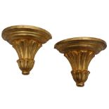 A PAIR OF GILTWOOD AND GESSO DEMI-LUNE WALL BRACKETS