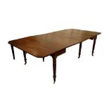 A REGENCY MAHOGANY CONCERTINA EXTENDING DINING TABLE