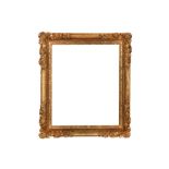 A FRENCH LOUIS XIV CARVED AND GILDED LEBRUN STYLE FRAME