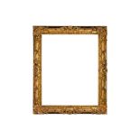 AN IMPRESSIVE EARLY 18TH CENTURY BRITISH ROCOCO CARVED AND PIERCED GILTWOOD FRAME