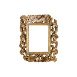 AN ITALIAN VENETIAN 17/18TH CENTURY CARVED, PIERCED AND GILDED FRAME