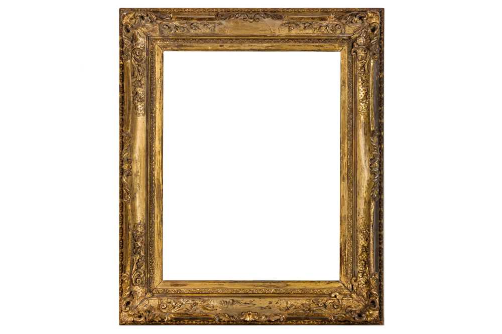 A CHINA TRADE LOUIS XIV STYLE CARVED AND GILDED FRAME