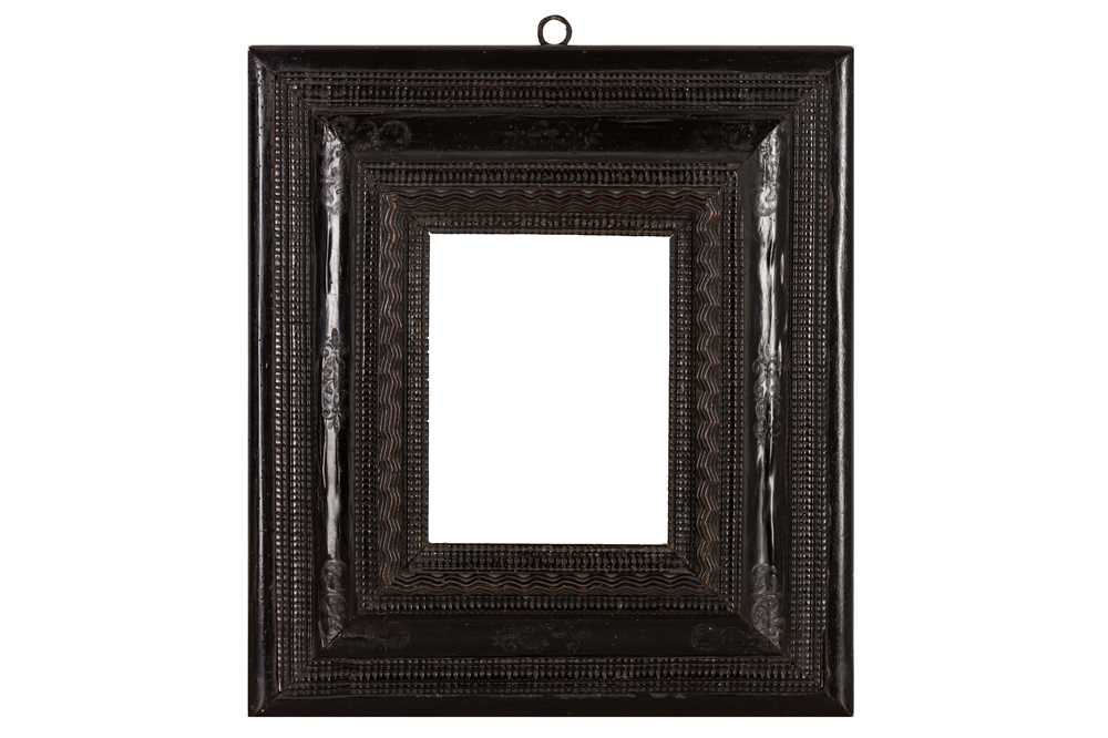 A NORTHERN ITALIAN 17TH CENTURY EBONISED REVERSE PROFILE RIPPLE FRAME