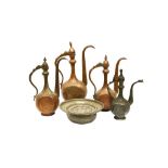 FOUR ENGRAVED TINNED COPPER EWERS AND A BASIN Central Asia, late 19th - early 20th century