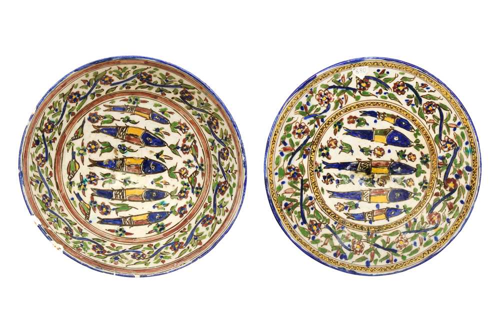 A POLYCHROME-PAINTED POTTERY BOWL AND SERVING PLATE WITH FISH DESIGN Iran, first half 20th century