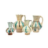 FOUR SMALL SELJUK SPLASHED POTTERY JUGS Iran or Afghanistan, 12th - 13th century