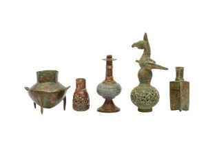TWENTY-ONE SMALL SELJUK BRONZE VESSELS, ACCESSORIES, AND FRAGMENTS Iran and Central Asia, 12th - 14t