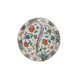 AN IZNIK POTTERY DISH WITH FLORAL TRIUMPH Ottoman Turkey, late 16th century