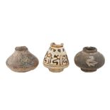 THREE MINIATURE POTTERY JARS WITH AVIARY MOTIFS AND PSEUDO-CALLIGRAPHY Possibly Iran, 12th - 13th ce