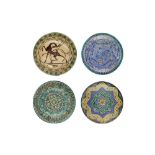 FOUR MOROCCAN POLYCHROME-PAINTED POTTERY CHARGERS Morocco, North Africa, late 19th - first half 20th