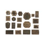 NINETEEN BRASS DECORATIVE MOULDS FOR TOOLING LEATHER COVERS Kashmir and Northern India, 19th century