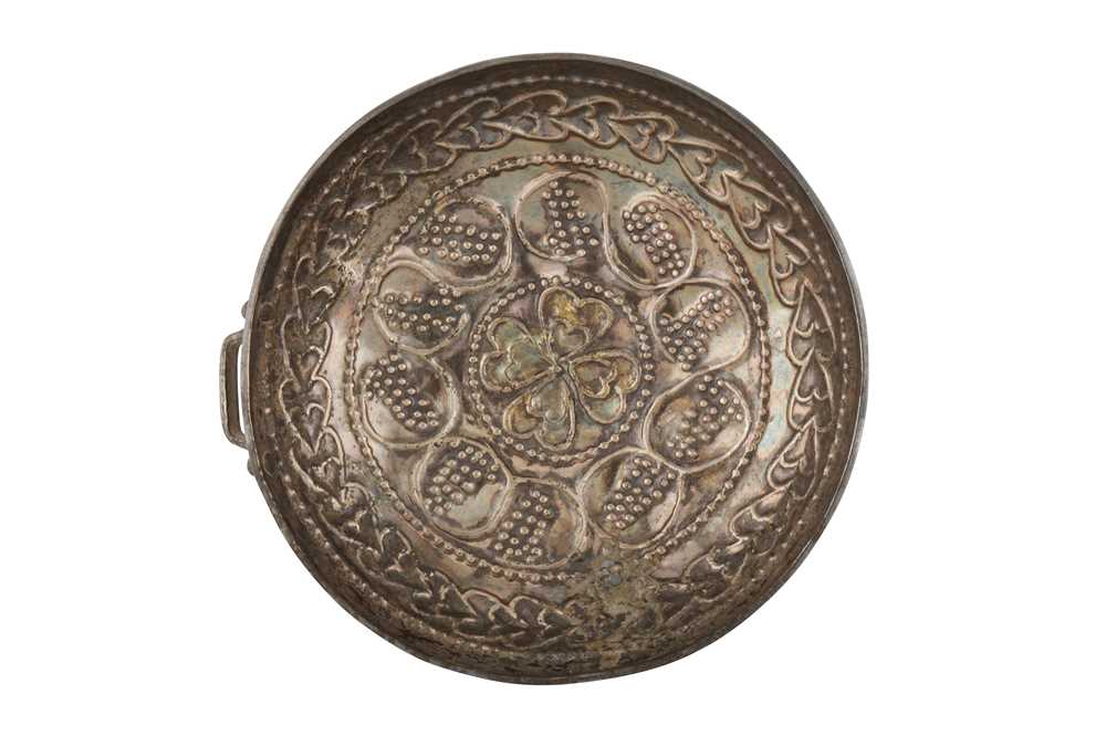 A CHASED SILVER CUP WITH GRAPEVINES Possibly Sasanian or Early Islamic Iran, ca. 500 - 750 AD