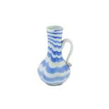 AN OPALESCENT WHITE AND BLUE MARVERED GLASS JUG Beykoz, Istanbul, Ottoman Turkey, 18th - early 19th