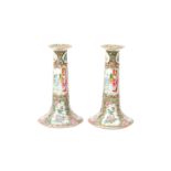 A PAIR OF CHINESE CANTON FAMILLE-ROSE CANDLESTICKS 清十九世紀 廣彩人物故事圖紋燭臺一對