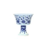 A CHINESE BLUE AND WHITE 'LANÇA-CHARACTER' STEM CUP 民國時期 青花纏枝蓮托梵文高足盃