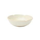 A SMALL CHINESE WHITE-GLAZED FOLIATE BOWL 宋 白釉葵口盌