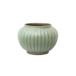 A CHINESE CELADON-GLAZED RIBBED JAR 青釉百條罐