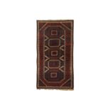 AN UNUSUAL ANTIQUE BALOUCH RUG, NORTH-EAST PERSIA