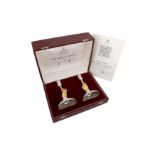 A CASED PAIR OF ELIZABETH II PARCEL GILT STERLING SILVER COMMEMORATIVE CANDLESTICKS, LONDON 1977 BY