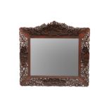 A CHINESE EXPORT CARVED HARDWOOD WALL MIRROR