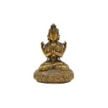 A TIBETAN GILT BRONZE FOUR-ARMED STATUE OF AVALOKITESHVARA