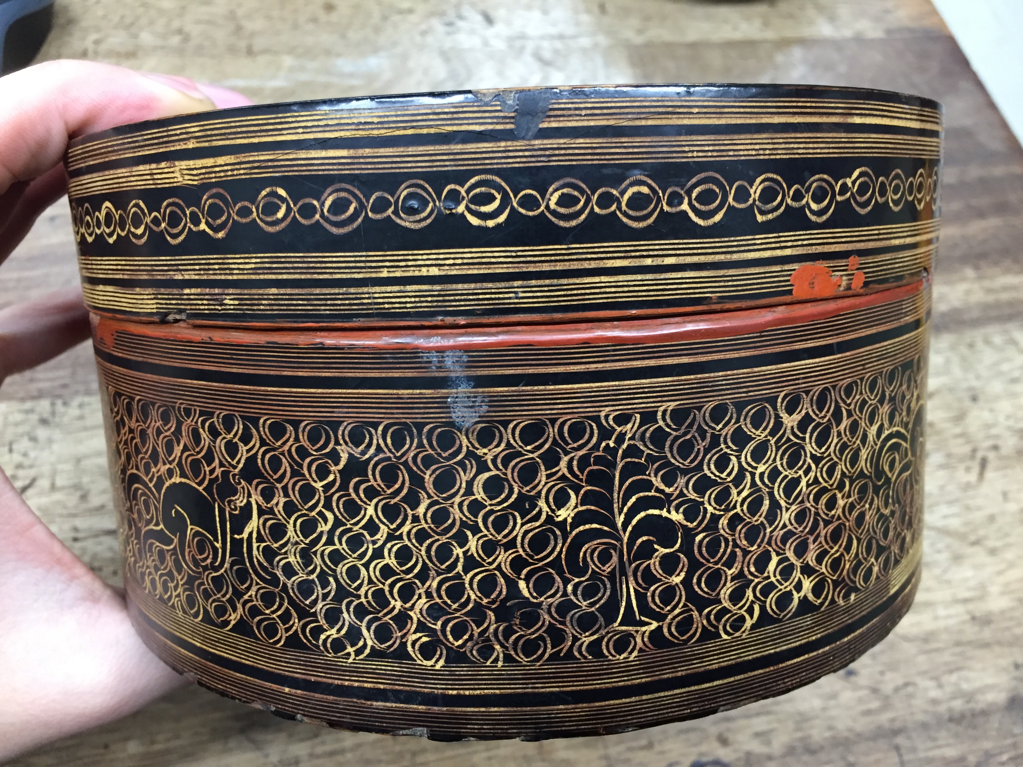 A BURMESE RED AND BLACK LACQUER 'MYTHICAL CREATURE' BETEL-BOX AND COVER OFFERED ON BEHALF OF - Image 12 of 23