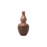 A CHINESE PEACHBLOOM-GLAZED DOUBLE-GOURD VASE 清十九世紀 豇豆紅釉葫蘆瓶