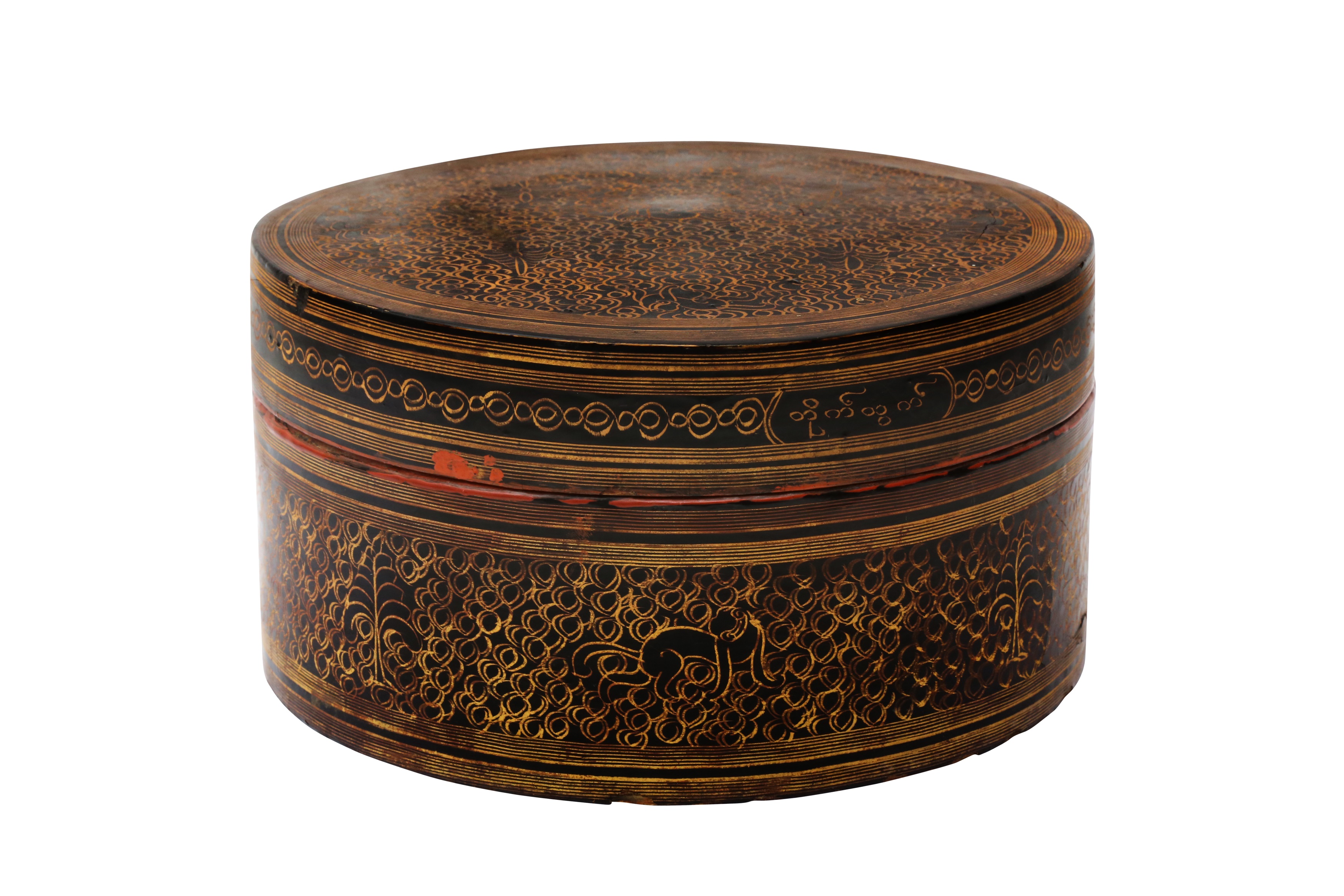 A BURMESE RED AND BLACK LACQUER 'MYTHICAL CREATURE' BETEL-BOX AND COVER OFFERED ON BEHALF OF