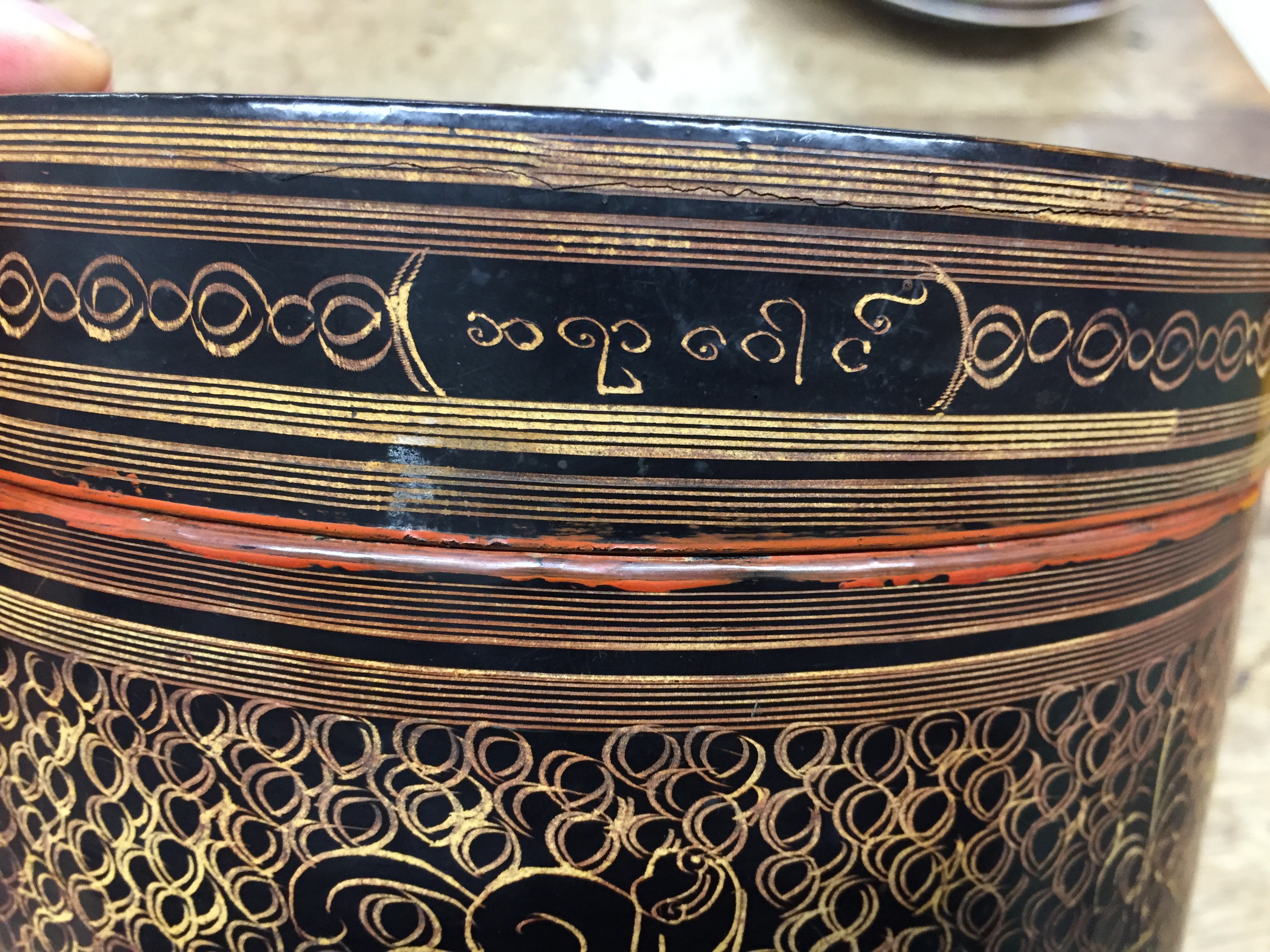A BURMESE RED AND BLACK LACQUER 'MYTHICAL CREATURE' BETEL-BOX AND COVER OFFERED ON BEHALF OF - Image 6 of 23