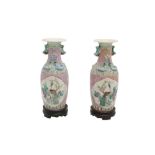 A PAIR OF 19TH CENTURY CHINESE FAMILLE ROSE BALUSTER FORM VASES