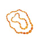 TWO AMBER BEAD NECKLACES