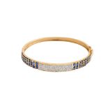 A DIAMOND AND SAPPHIRE BANGLE, 1990