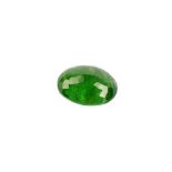 A NATURAL OVAL-SHAPED FACETED GREEN TSAVORITE GARNET