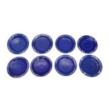 A GROUP OF EIGHT CHINESE REVERSE SLIP GLAZED COBALT BLUE AND WHITE DISHES