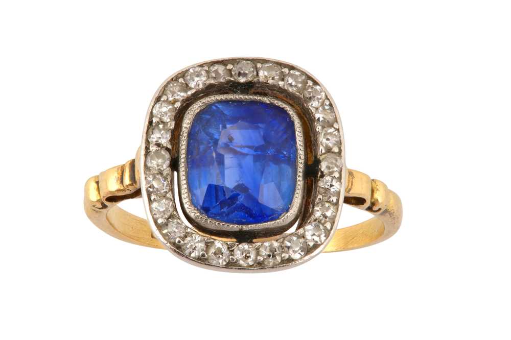 A SAPPHIRE AND DIAMOND CLUSTER RING