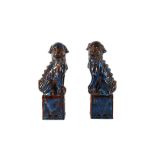 A PAIR OF CHINESE FLAMBÉ-GLAZED FIGURES OF LION DOGS, 20TH CENTURY