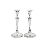 A pair of Edwardian sterling silver candlesticks, Sheffield 1909 by Elkington and Co