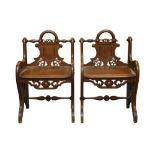 A PAIR OF VICTORIAN OAK HALL CHAIRS