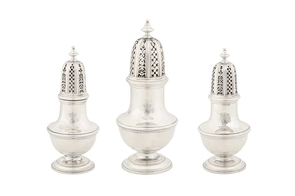 A graduated set of three mid-18th century unmarked silver casters, possibly West Indian c