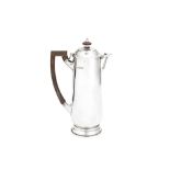 A George V 'Arts and Crafts' sterling silver hot water or coffee pot, London 1915 by Charles John Pl