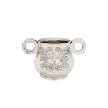 A George V sterling silver ‘Ox Eye’ or college twin handled cup, Chester 1925 by S Blanckensee and S