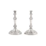 A pair of Louis XV mid - 18th century French provincial silver candlesticks, Le Mans 1756 -62 by Jea