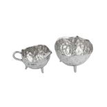 A Victorian ‘Arts and Crafts’ sterling silver strawberry set, London 1883 by Hukin and Heath, the de