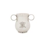 A Victorian sterling silver 'Ox Eye' or college twin handled cup, London 1863 by George John Richard