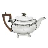 A George III Irish sterling silver teapot, Dublin 1818 by William Nolan, retailed by William Law