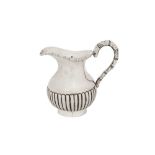 An early 20th century Chinese Export silver milk or cream jug, Canton circa 1920 by Da Ji, retailed